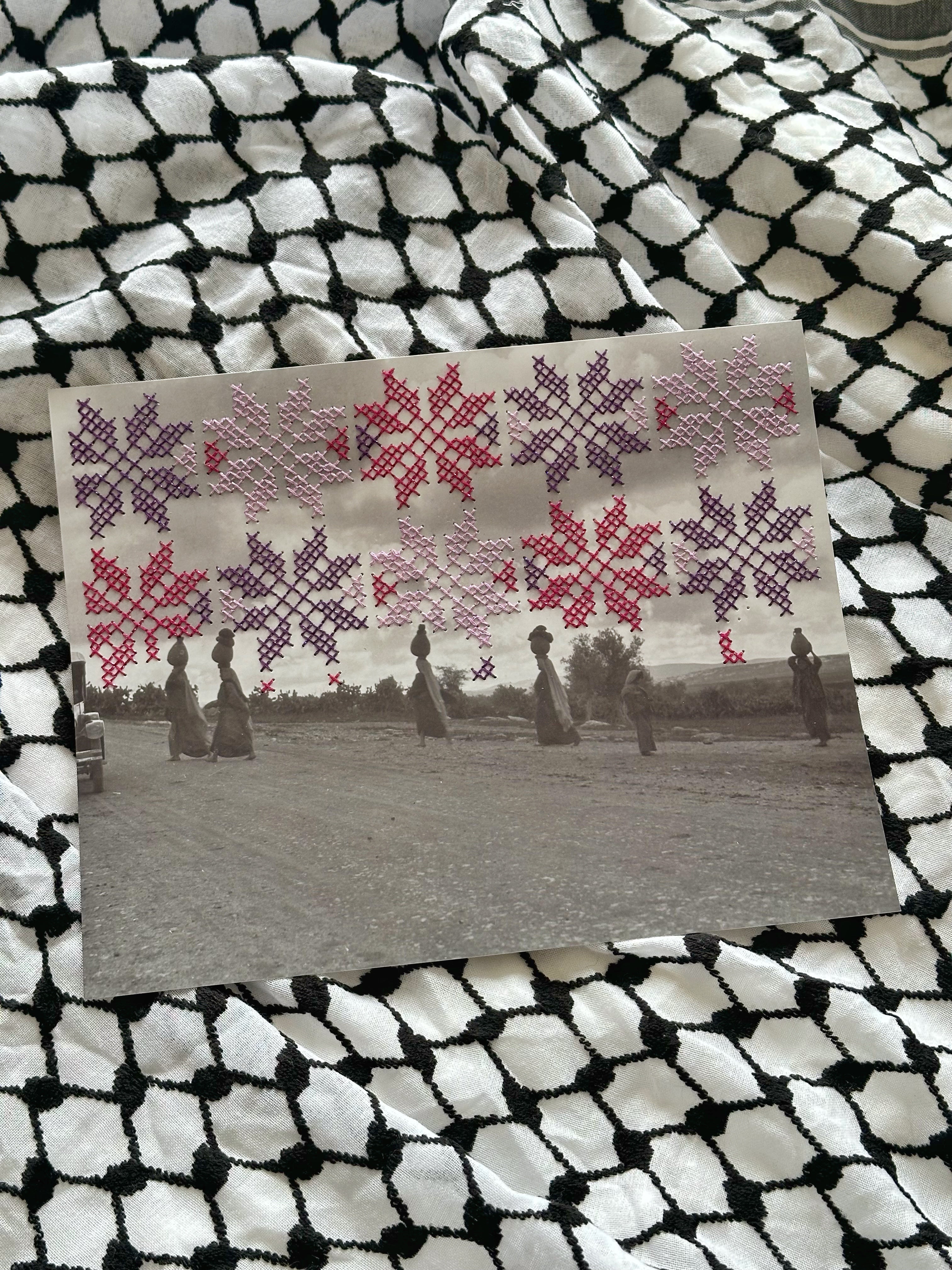 pink and purple tatreez pattern stitched onto black and white photograph 
