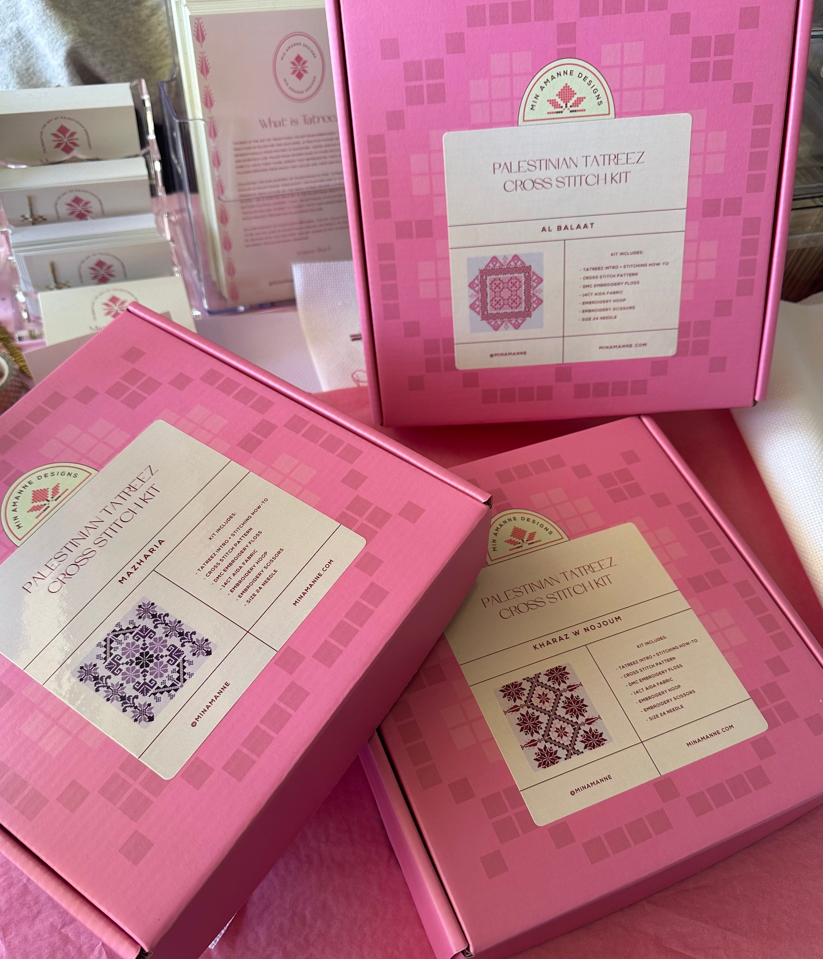 three tatreez kits with pink packaging 