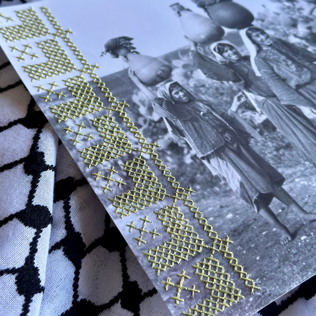 close up of green tatreez stitched onto photograph 