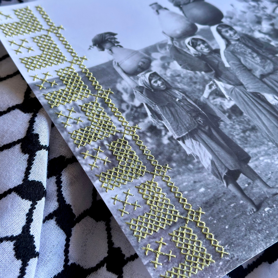 close up of green tatreez stitched onto photograph 